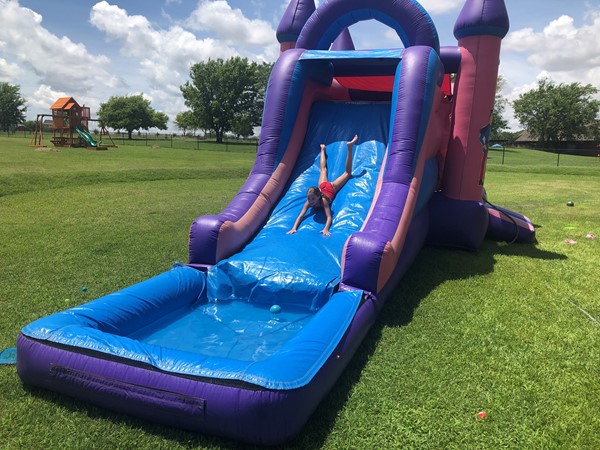 A slippery water slide mean summer fun for this little guy in Skiatook,好
