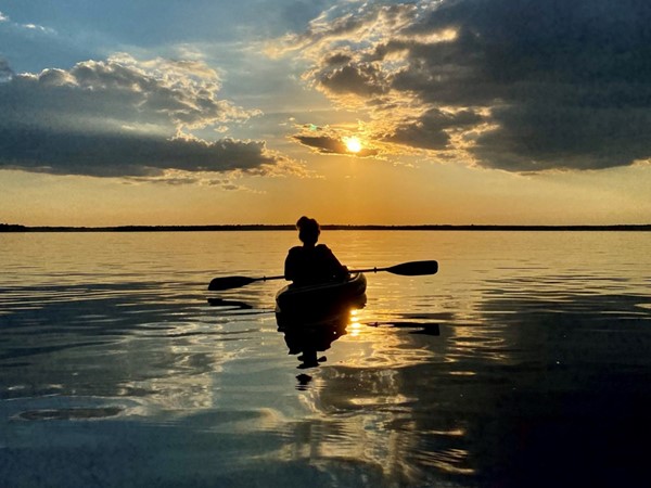 Kayaking into the sunset on Lake Mitchell 