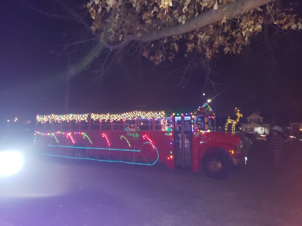 Santa bus goes from neighborhood to neighborhood visiting kids 