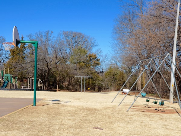 Wellington Park swings, playground, basketball court, and walking trail