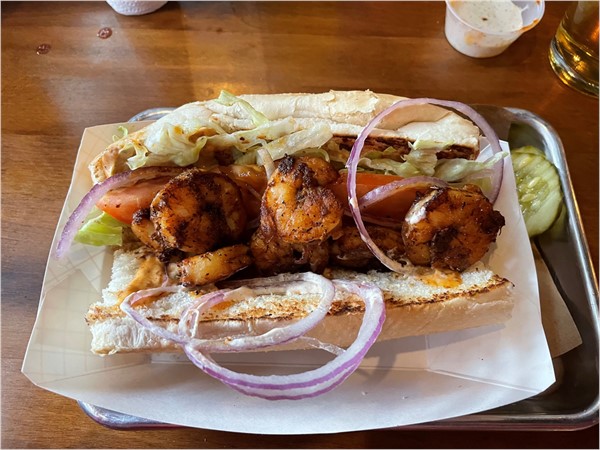 3 Halves Brewery in Downtown Liberty is a must go!  They had a shrimp po-boy for Mardi Gras