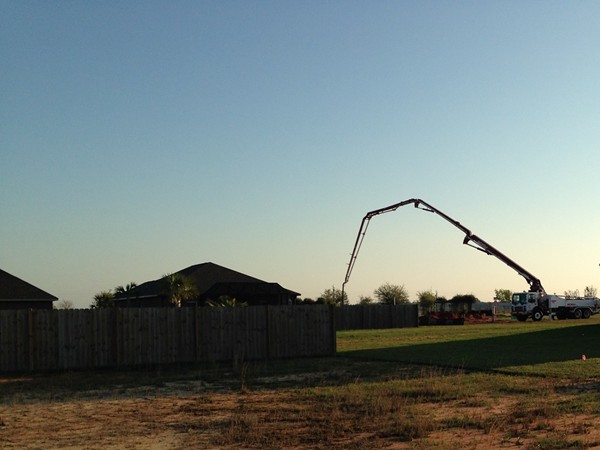 Concrete being poured for another new home in Craft Farms North, Gulf Shores