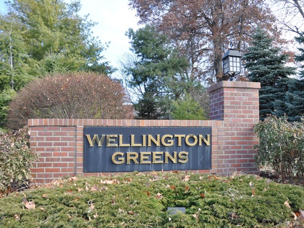 The main entrance to Wellington Greens, a townhouse community with a private par 3 golf course