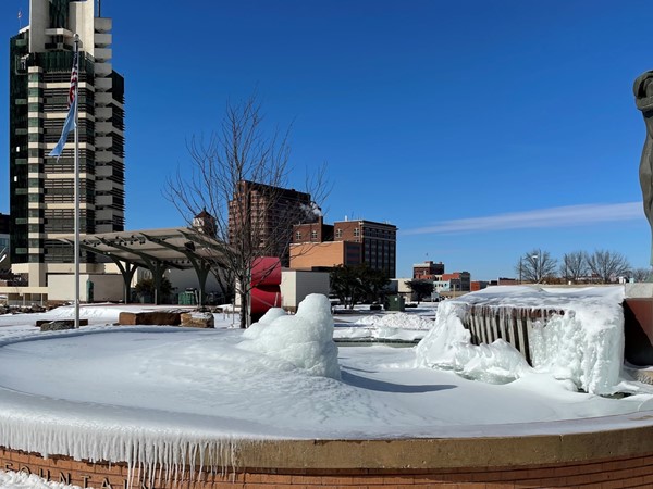 Alton at Unity Square is frozen over, with Frank Lloyd Wright-Price Tower in the background.