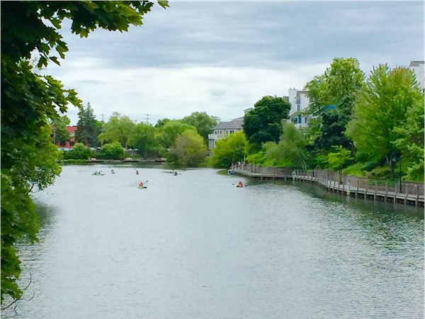 Kayakers on the Boardman River in Midtown.  A view from the Union Street bridge