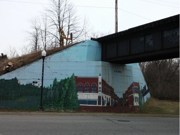 Hand painted train bridge mural