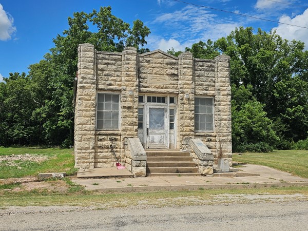 Sturdy stone and shuttered windows—this 1936 Elmdale City Hall still stands tall.