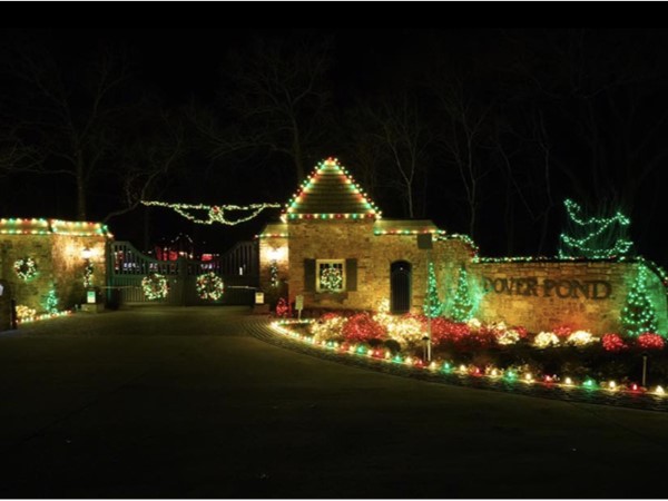 The entrance gate lit up at night to Dover Pond.  Ready to welcome Christmas