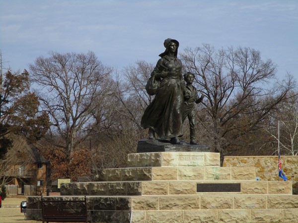 The Pioneer Woman monument is a bronze sculpture depicting a woman leading a child