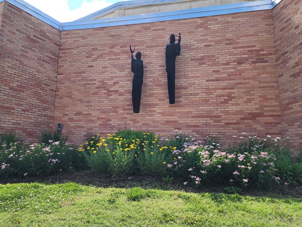 Unique art work and flowers that make the Emporia State University campus beautiful