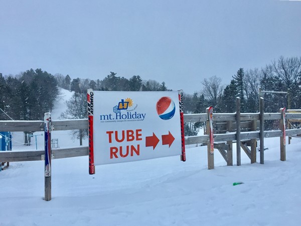 Afterglow tubing under the lights at Mt Holiday is a fun date night or family night