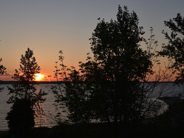 Sunset over Grand Traverse Bay in the quaint Village of Elk Rapids