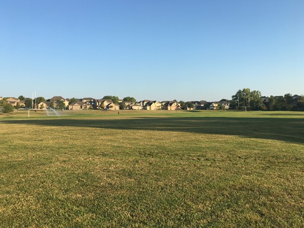 View of football field and Copperfields homes in the background from Copperfields Park