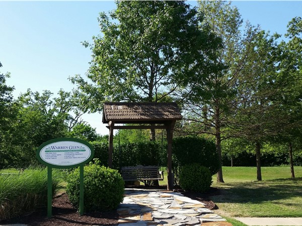 One of many green spaces and park type areas in this delightful and desired Rogers subdivisions