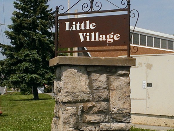 The quiet, quaint subdivision of Little Village with tree lined streets