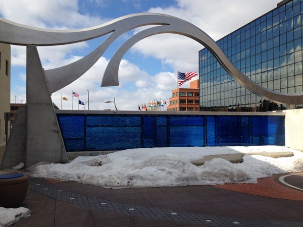 Located in downtown Battle Creek there is a very fun fountain in front of this sculpture. 
