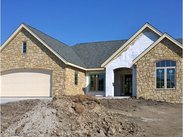 Stone façade complete on this custom home in the Reserve at McFarland Farm