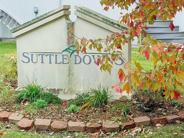 A monument sign for Suttle Downs on West 75th Street in Shawnee