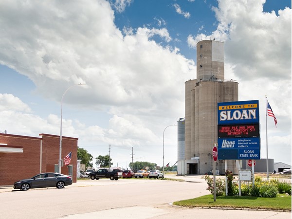The grain elevators make a great backdrop for the Welcome to Sloan Sign
