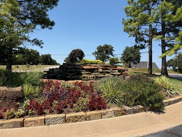 Beautifully landscaped neighborhood entrance at Shadow Ridge in Edmond