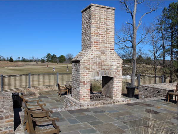 The Squire Creek Golf Houses feature a homey outdoor fireplace area for company outings