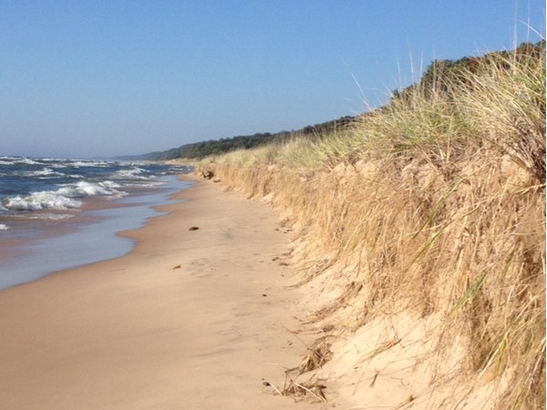 Hike the trail at PJ Hoffmaster Park or camp and enjoy the dunes even longer