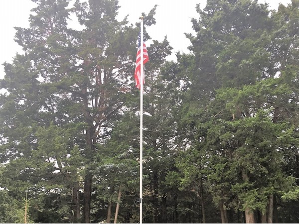 New flag pole is dedicated to one of the homeowners that passed away, Mr. Edwards