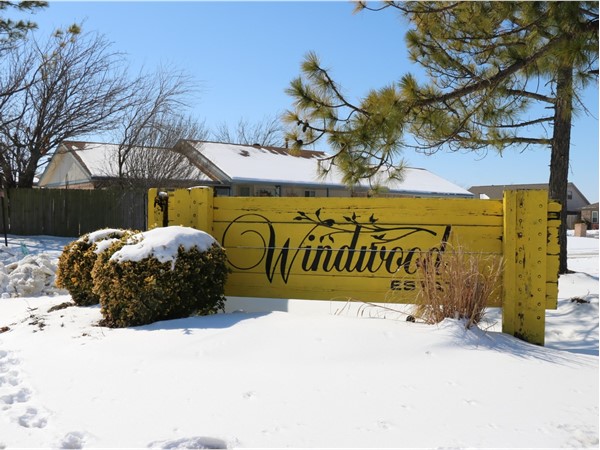 The bright yellow sign of Windwood Estates can not be missed 