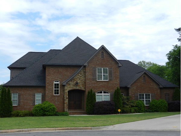 Stone entrance welcomes you to this two story custom built house in desirable Crown Pointe.