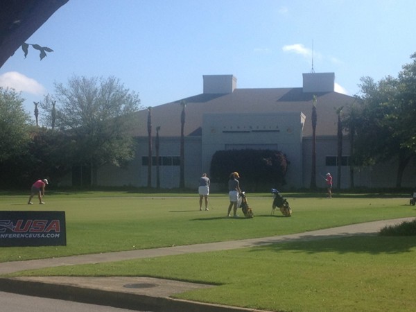 Ladies warming up for Conference USA Women's Golf Championship at The Peninsula