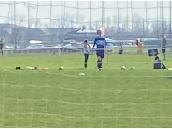 Girls soccer fun and views through the net in Prairie Ridge Park