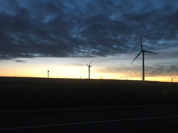 Becautiful winter sunrise over wheat fields and wind turbines make for a great start to the day