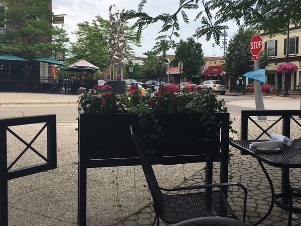 Enjoy a meal on the patio in the Gaslight Village in East Grand Rapids