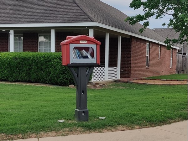 129th E. Ave entrance, you can find one of two sharing libraries within The Falls at Garrett Creek.