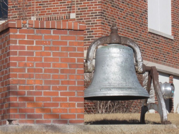An antique school bell in front of the Elkhorn School District admissions office 