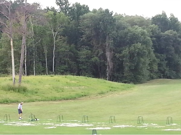 Get some swing practice on the range at Emerald Mountain Golf Course