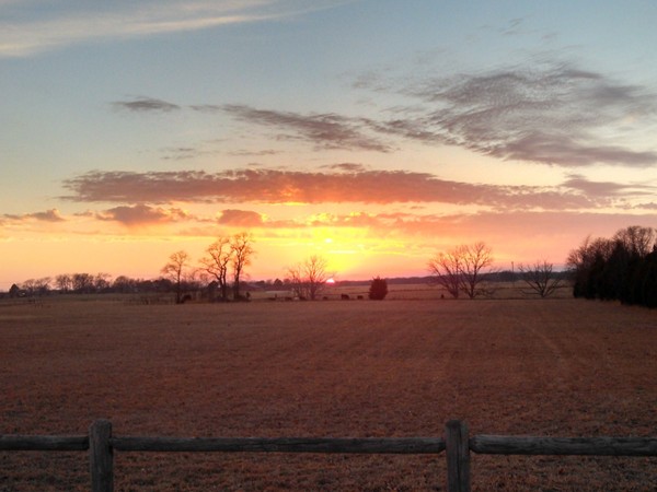 Gorgeous sunset over rolling acres of pasture