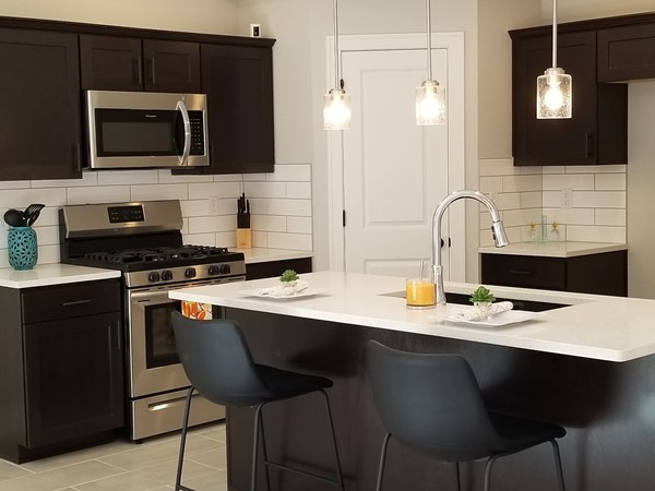 Quartz countertops, walk-in pantry, stainless steel appliances, white or stained cabinetry