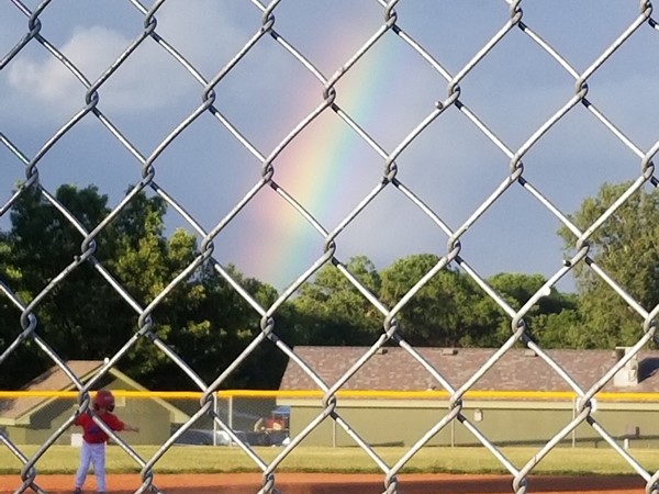 A rainbow in the backdrop for today's game, in Greenwood