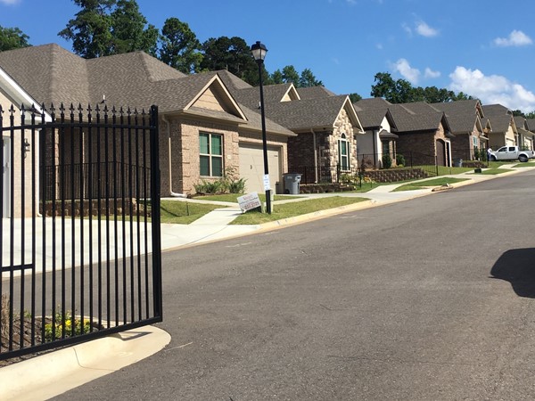 Gated entrance and some of the homes in Hunter Crossing subdivision in Bryant