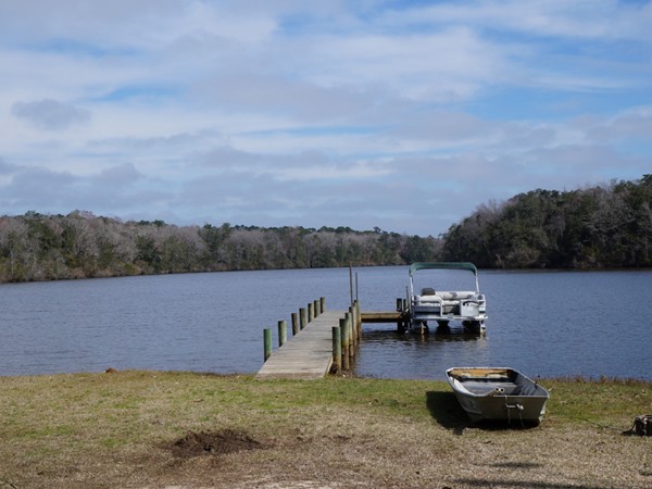 Peaceful Bay Minette Creek is actively used by fishermen and offers a view for commuters