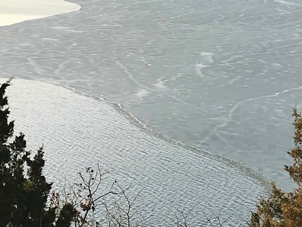 Look closely, you can see the wind making waves under the thin ice. February on Table Rock Lake