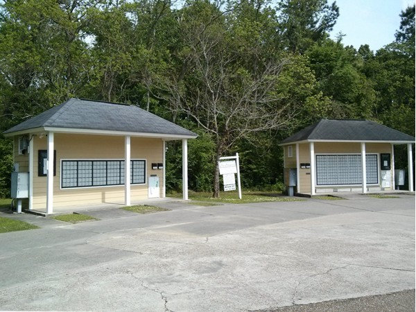 Community mailboxes and welcome sign in Azalea Lakes Subdivision.