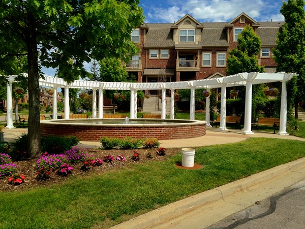 Attractive landscaping and pergola add to the beauty of this development