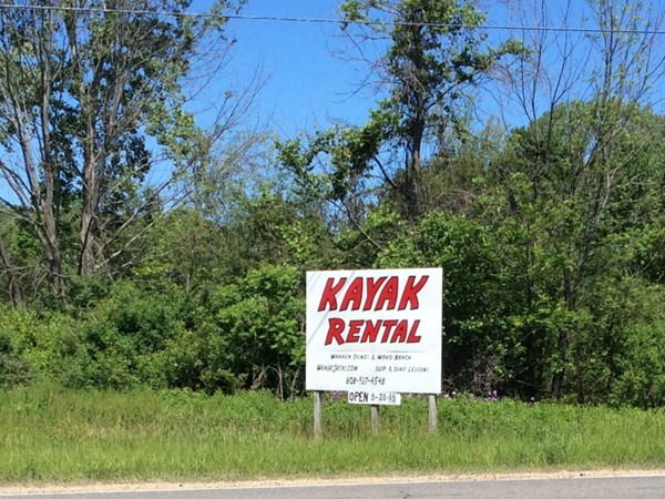 Summer is here!  New signs are popping up everywhere like this one for kayak rental at Weco Beach