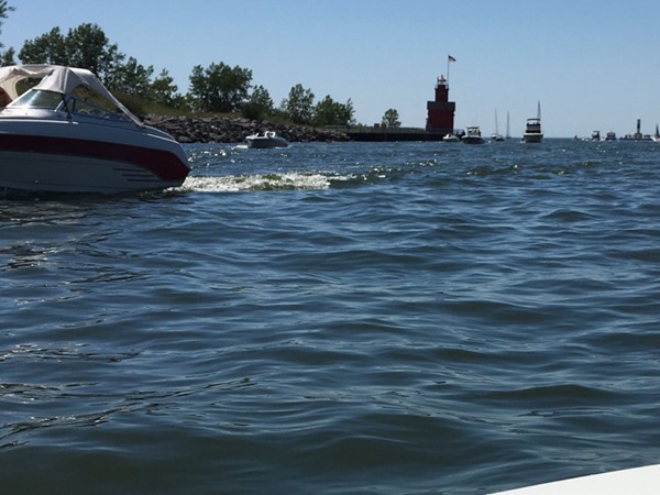Heading through the channel by boat on Lake Macatawa to Lake Michigan is relaxing 