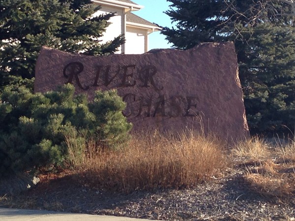 Entrance to River Chase south of Hwy 370 and East of 96th
