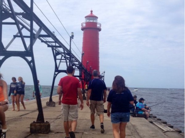 Walking the pier at Grand Haven Beach is a favorite pastime