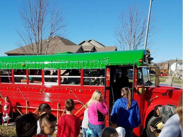Santa Bus going from neighborhood to neighborhood bringing joy to all the boys and girls 