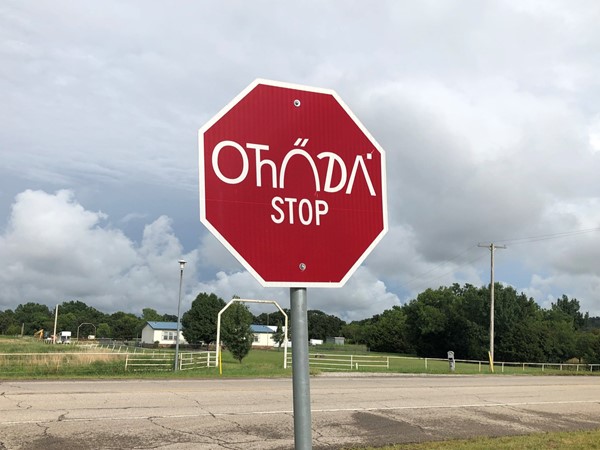 The stop sign at the Ed Red Eagle Park is written in the Osage native language 